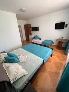 Postel nebo postele na pokoji v ubytování Hotel NATALI