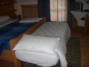 Postel nebo postele na pokoji v ubytování Albergo Garni' Laura