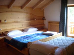 Postel nebo postele na pokoji v ubytování Albergo Garni' Laura