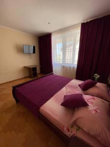 Postel nebo postele na pokoji v ubytování Hotel NATALI