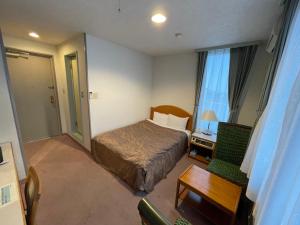Postel nebo postele na pokoji v ubytování Hotel Ginsui
