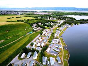 an aerial view of a parking lot next to a lake at Vault 21 in Millom