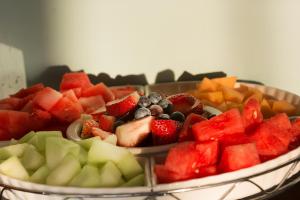 two bowls filled with fruit on a table at Elizabeth Pointe Lodge in Fernandina Beach