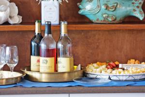 two bottles of wine sitting on a table with food at Elizabeth Pointe Lodge in Fernandina Beach