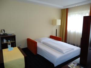 Postel nebo postele na pokoji v ubytování Akzent Hotel Löwen
