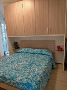 En eller flere senge i et værelse på Casa Giada