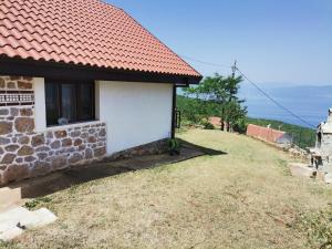 a stone house with a red roof at Villa Sofia in Ohrid