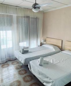 Posteľ alebo postele v izbe v ubytovaní Mesón Kubano B&B