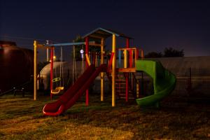 a playground at night with a slide and a slideintend at MARTI BUNGALOW in Demre