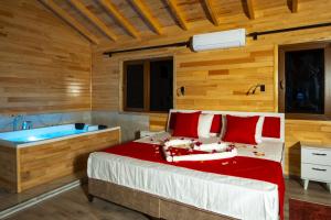 Postel nebo postele na pokoji v ubytování MARTI BUNGALOW