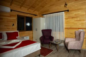 Postel nebo postele na pokoji v ubytování MARTI BUNGALOW