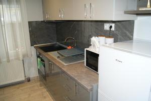 a kitchen with a sink and a counter top at City Room in Volos +13 photos