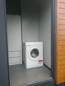 a washer and dryer in a small room at Gąski domek 800m od morza in Gąski