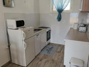 Kuchyň nebo kuchyňský kout v ubytování Apartment Vidovic