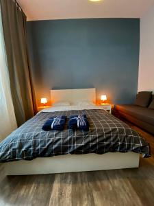 Posteľ alebo postele v izbe v ubytovaní Ametyst Apartments