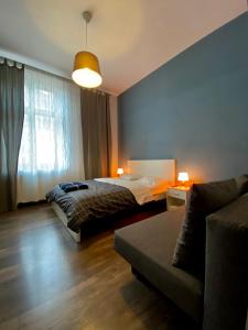 Posteľ alebo postele v izbe v ubytovaní Ametyst Apartments