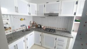 Kuchyň nebo kuchyňský kout v ubytování Appartement Martil a 5min de la corniche