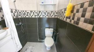 Koupelna v ubytování Appartement Martil a 5min de la corniche + 8 fotografií