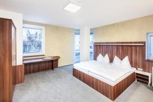 Postel nebo postele na pokoji v ubytování Graphic Hotel