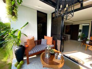 a living room with a couch and a table at Villa inspired with exclusive dipping pool in Bacolod