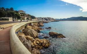 a bridge over a body of water with rocks at Appartement Plage Prado/Vélodrome in Marseille