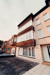 a brick building with a lot of windows at Floride, The Perfect Getaway in Koksijde