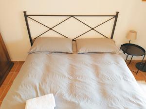A bed or beds in a room at Villa Vittorio - Splendid panoramic sea view terrace