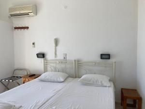 Postel nebo postele na pokoji v ubytování Hotel Galini
