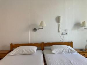 Postel nebo postele na pokoji v ubytování Hotel Galini