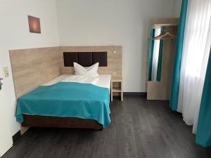 Postel nebo postele na pokoji v ubytování Hotel Steakhouse Am Rathaus
