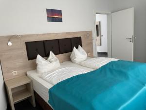 Postel nebo postele na pokoji v ubytování Hotel Steakhouse Am Rathaus