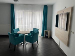 TV a/nebo společenská místnost v ubytování Hotel Steakhouse Am Rathaus