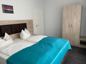 Postel nebo postele na pokoji v ubytování Hotel Steakhouse Am Rathaus