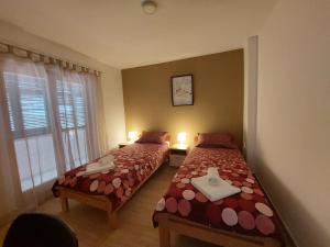 מיטה או מיטות בחדר ב-Apartment Luisa