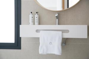 a bathroom with a white sink and a mirror at Quinta San Francisco in Castrojeriz +57 photos