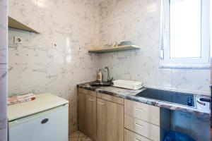 Kuchyňa alebo kuchynka v ubytovaní Apartments & Rooms Strčić Petra