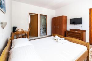 Posteľ alebo postele v izbe v ubytovaní Apartments & Rooms Strčić Petra