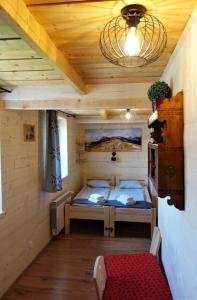 Posteľ alebo postele v izbe v ubytovaní Zakodomki Apartement Pyzdra