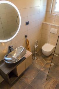 a bathroom with a sink and a toilet at Apartman Joso 2 in Sukošan
