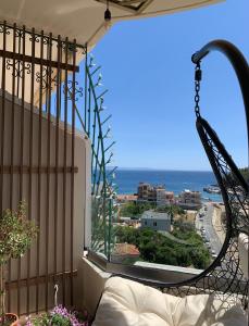 a balcony with a view of the ocean at Bluetique Apartments Himara in Himare