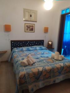 Posteľ alebo postele v izbe v ubytovaní Villa al Plemmirio
