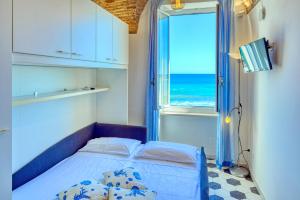 Ένα ή περισσότερα κρεβάτια σε δωμάτιο στο Il Balcone sul Prino