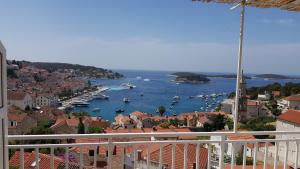 a view of a harbor with boats in the water at Apartments Boćin Rosso in Hvar
