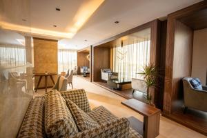 a living room with a couch and a table at Golden Rose Hotel in Jazan