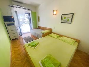 Posteľ alebo postele v izbe v ubytovaní Apartmani Dea