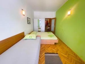 Posteľ alebo postele v izbe v ubytovaní Apartmani Dea