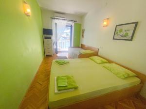Posteľ alebo postele v izbe v ubytovaní Apartmani Dea