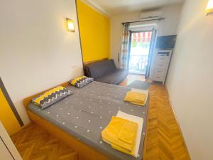 Posteľ alebo postele v izbe v ubytovaní Apartmani Dea