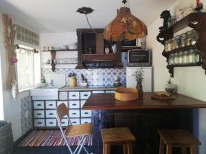 Kuchyň nebo kuchyňský kout v ubytování Casa S. Nicolau