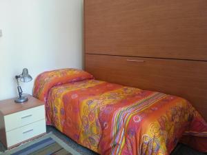 Ένα ή περισσότερα κρεβάτια σε δωμάτιο στο Hotel Mignon Posta